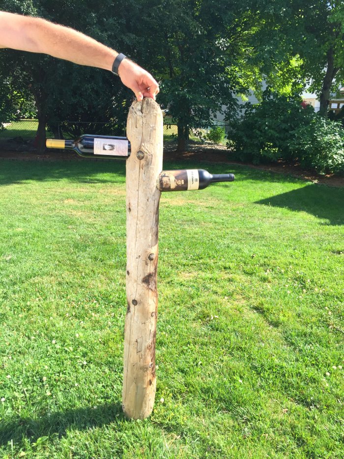 wine bottles in driftwood rack